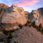 Mount Rushmore morning as the sun begins to light up the mountain.